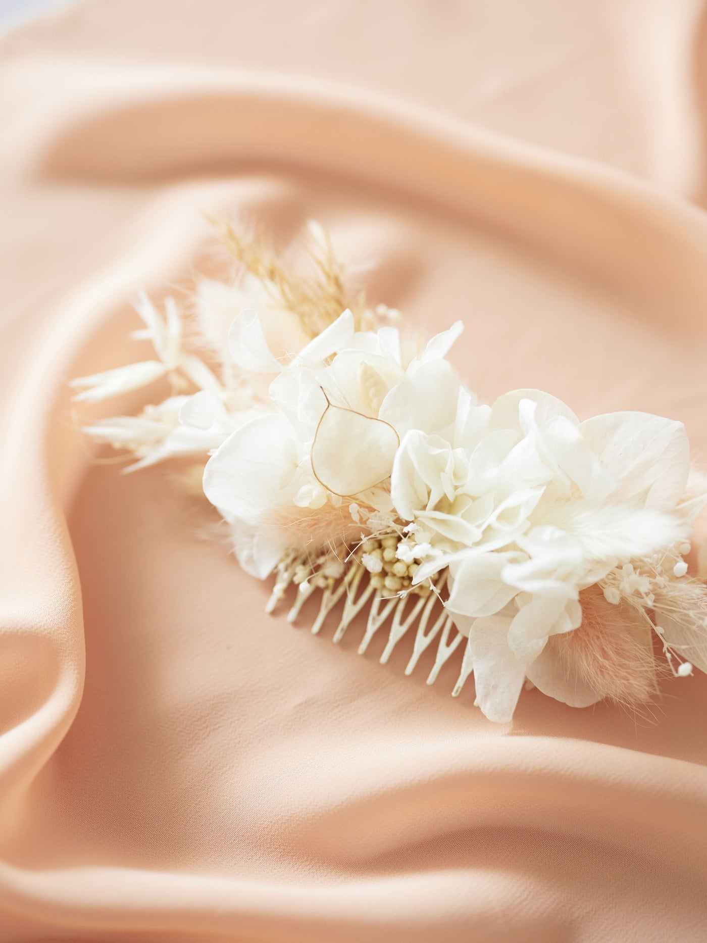 hair comb is lying on pink organza 2